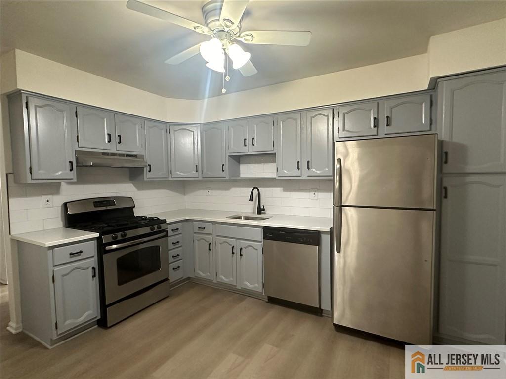 204 Maplecrest Road, Unit 204 Edison, NJ 08820 - Photo 1 of 15 a kitchen with stainless steel appliances granite countertop a refrigerator a stove a sink and white cabinets