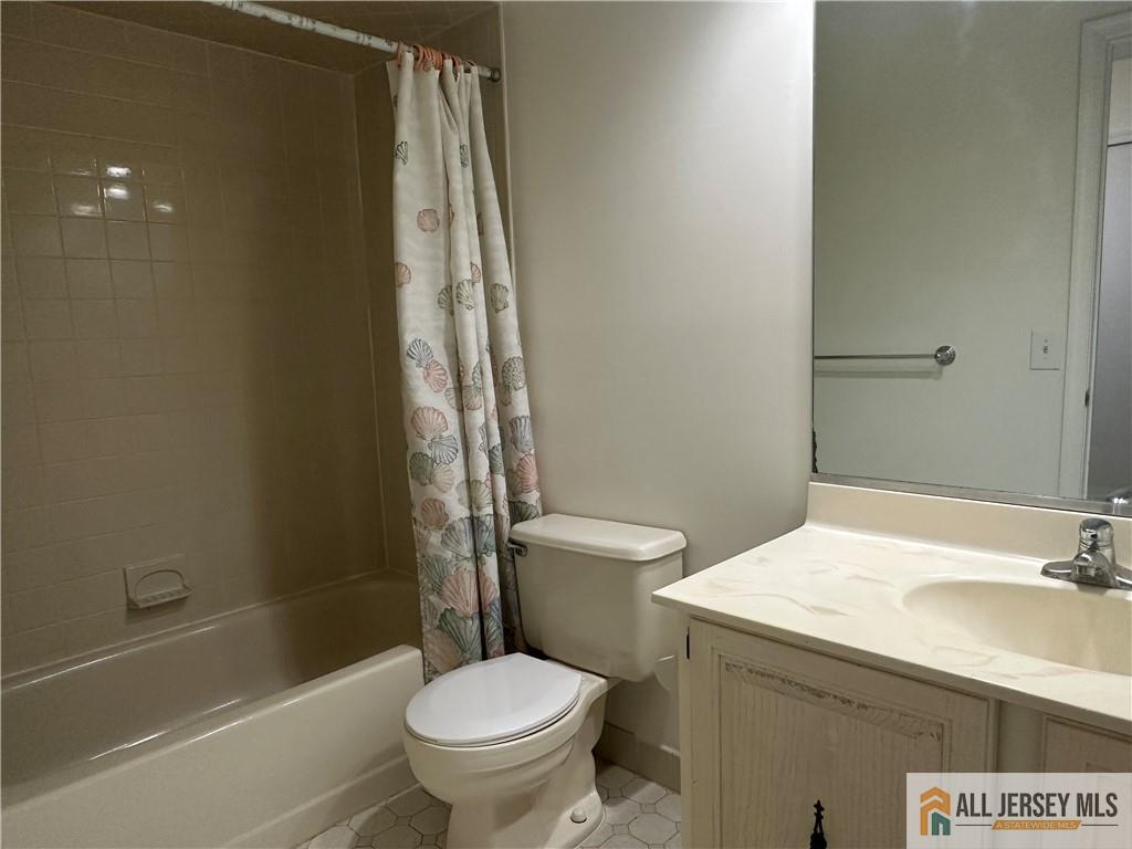 204 Maplecrest Road, Unit 204 Edison, NJ 08820 - Photo 13 of 15 a bathroom with a sink toilet and shower