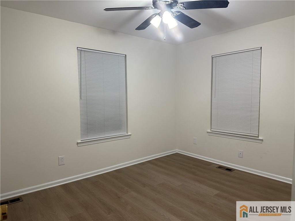 204 Maplecrest Road, Unit 204 Edison, NJ 08820 - Photo 15 of 15 a view of an empty room with wooden floor and a window
