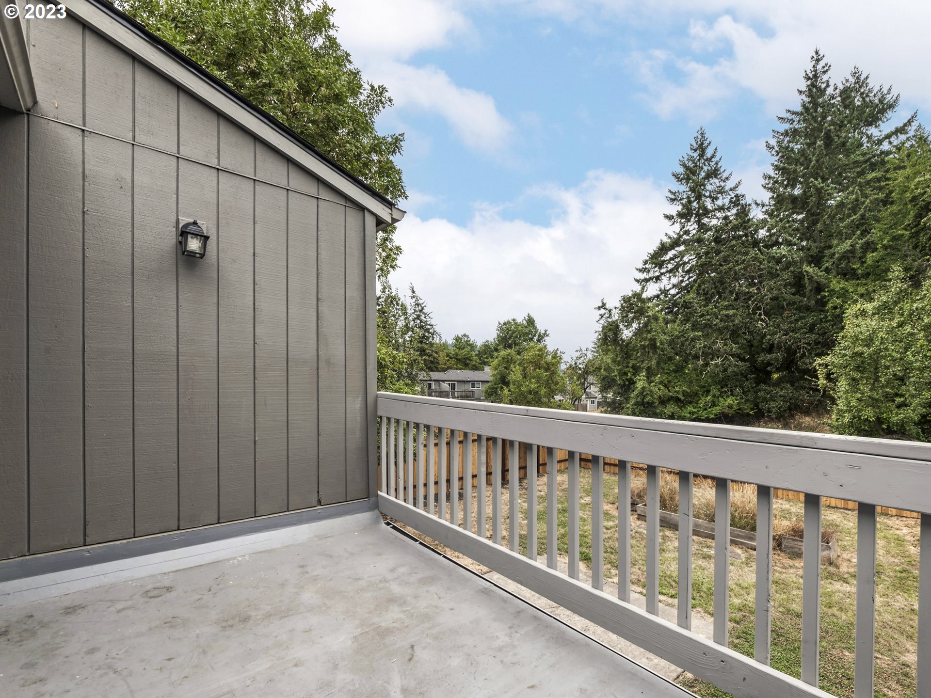 1357 East 43rd Avenue Eugene, OR 97405 - Photo 12 of 28 a view of a wooden fence from a balcony