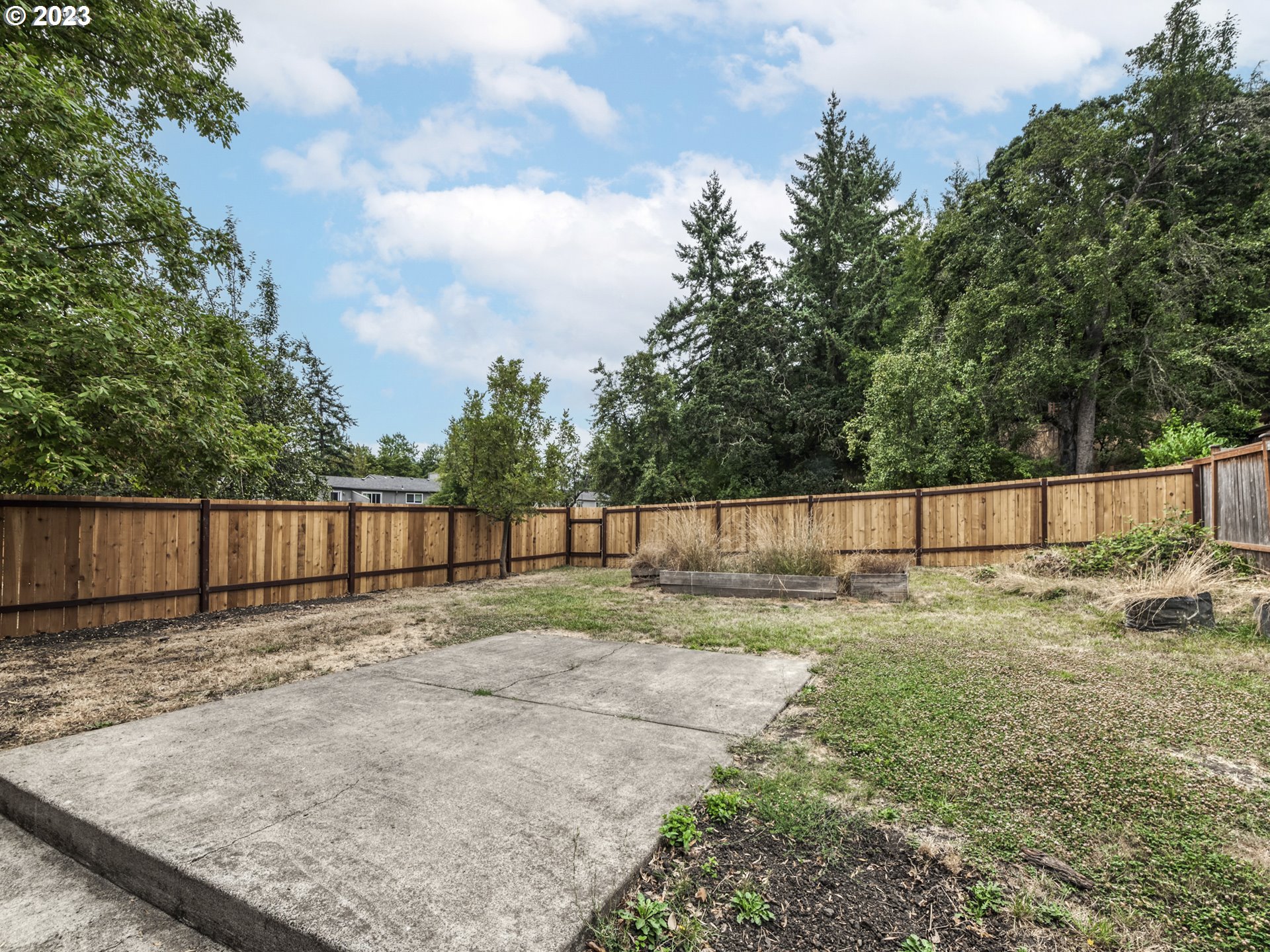 1357 East 43rd Avenue Eugene, OR 97405 - Photo 2 of 28 a backyard of a house with lots of green space