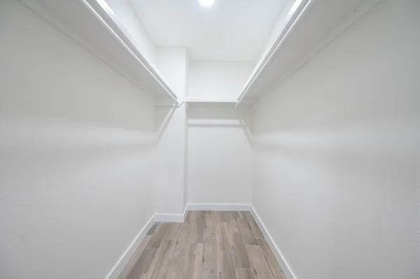 a view of wooden floor in a hallway