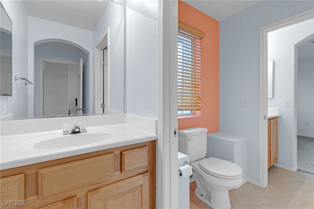 9065 Starling Wing Place Las Vegas, NV 89143 - Photo 20 of 53 Bathroom with vanity and light tile patterned flooring