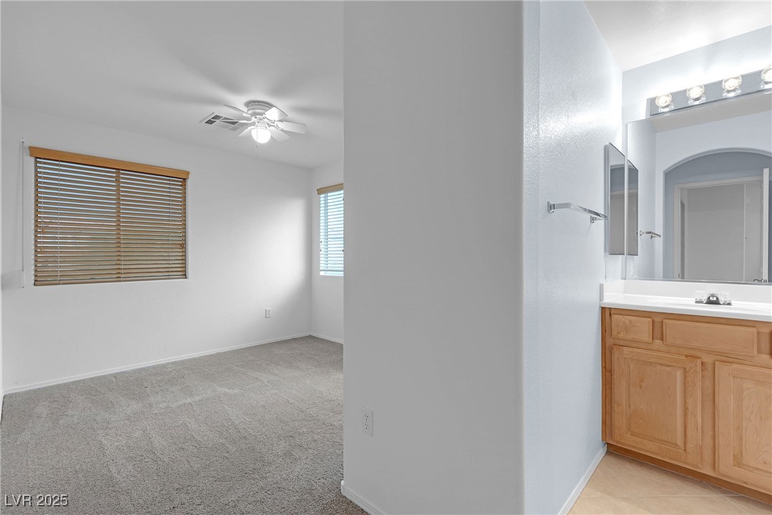 9065 Starling Wing Place Las Vegas, NV 89143 - Photo 21 of 53 Bathroom featuring vanity and a ceiling fan
