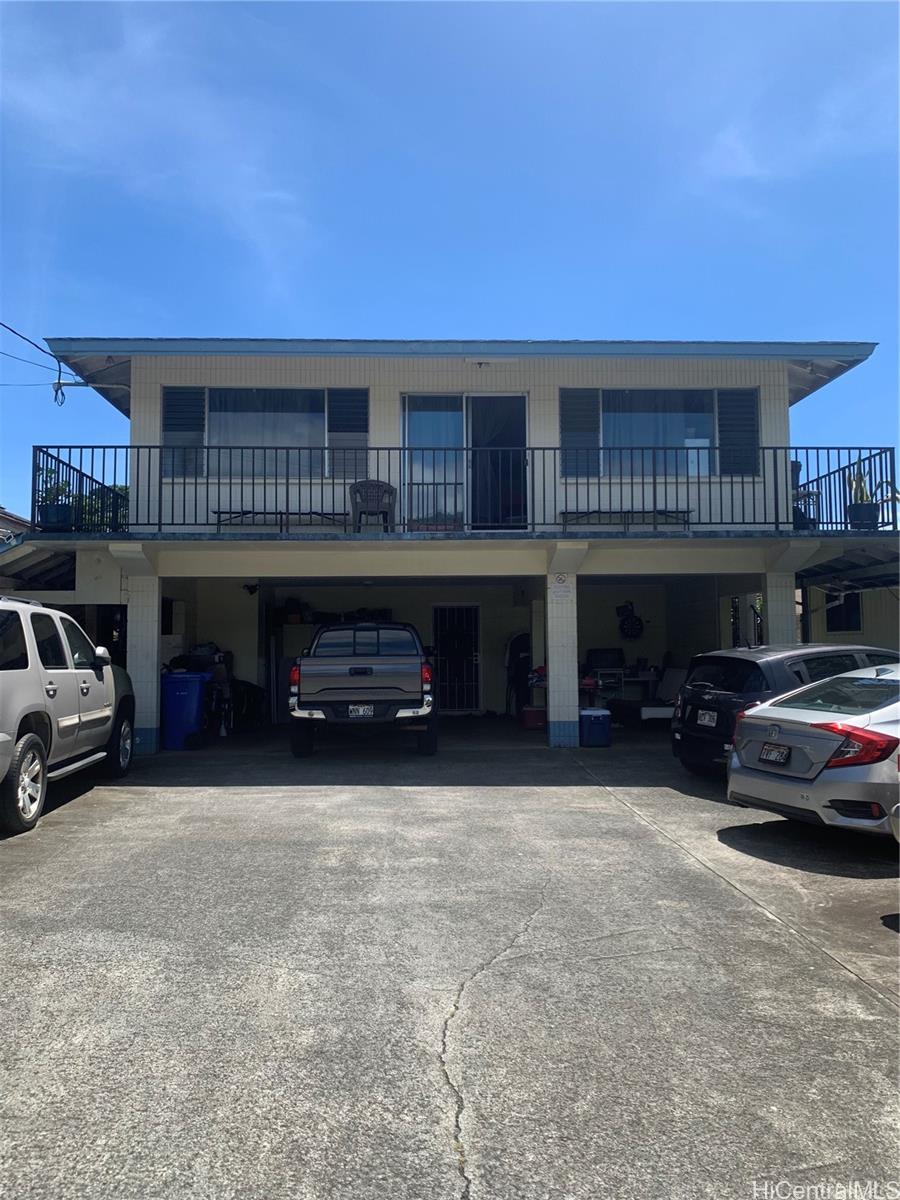 a black car in front of a building