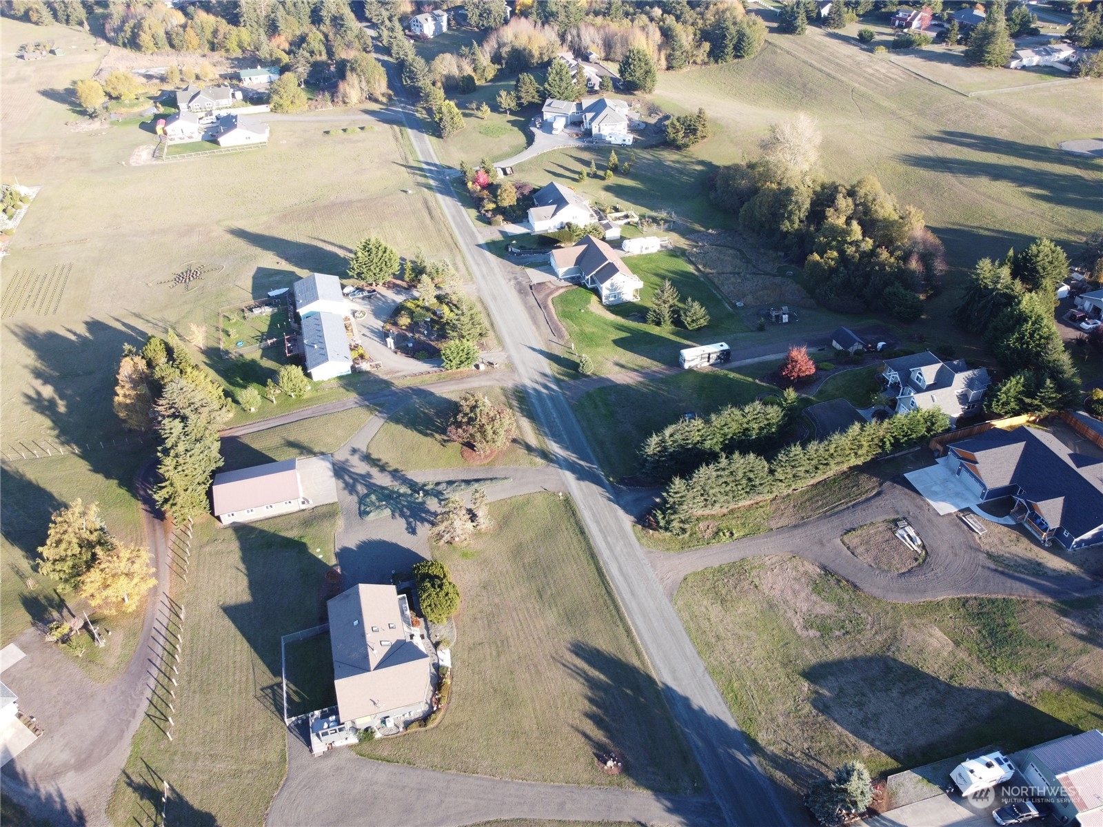 9999 Klahhane Road Sequim, WA 98382 - Photo 2 of 4 an aerial view of residential houses with outdoor space