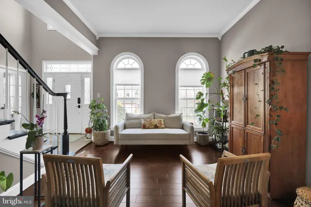 a kitchen with stainless steel appliances granite countertop a sink stove and white cabinets