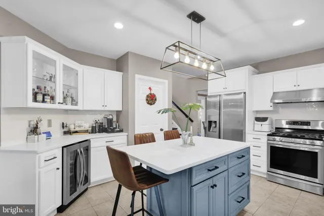 a bathroom with a sink mirror and vanity