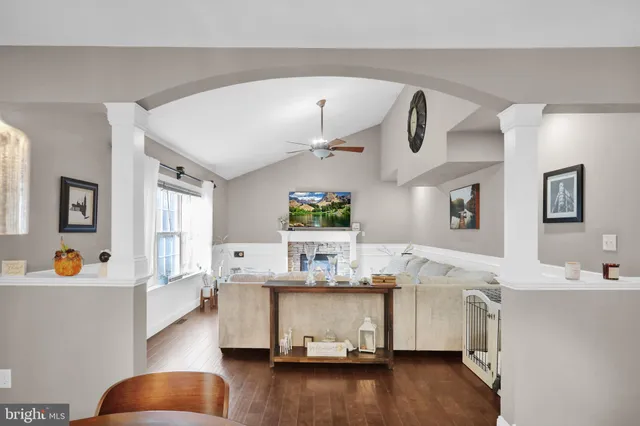 a view of entryway with wooden floor and stairs