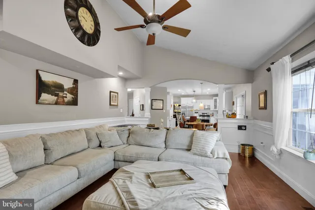 a bedroom with a bed and a large mirror