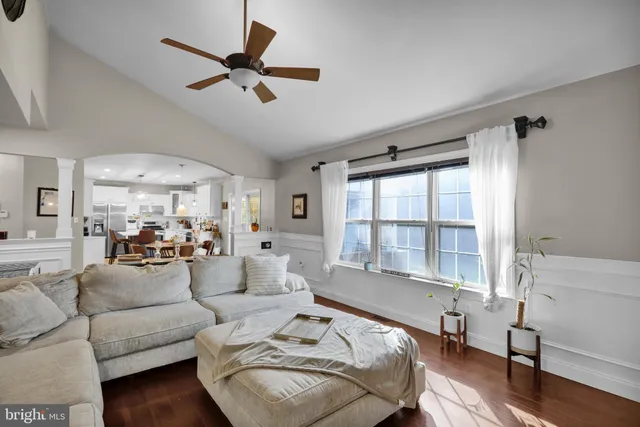 a spacious bedroom with a bed and a dresser