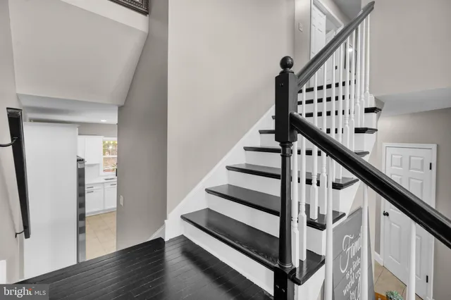 a bath tub sitting in a bathroom next to a window