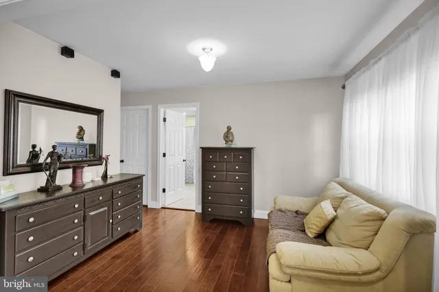 a bedroom with a bed and a table