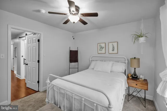an aerial view of a house with a yard and potted plants