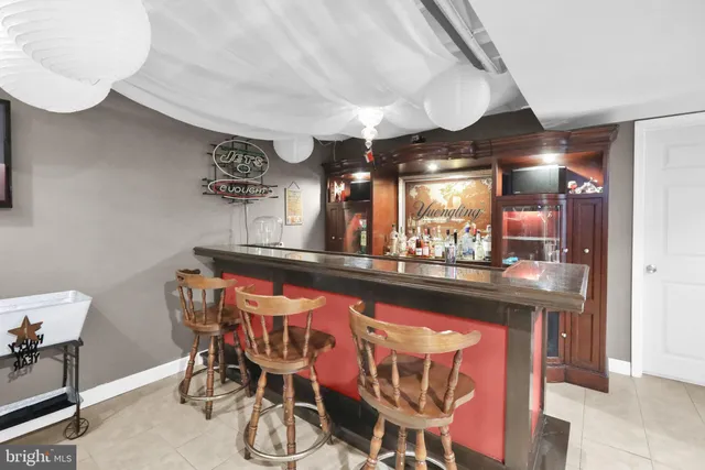 an aerial view of a house swimming pool and green space