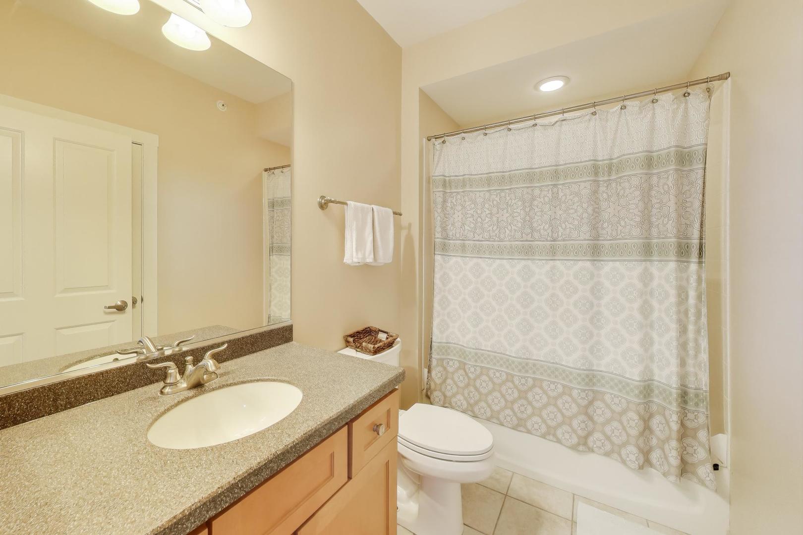 977 Harris Road, Unit 34 Grayslake, IL 60030 - Photo 14 of 27 a bathroom with a sink a toilet and shower