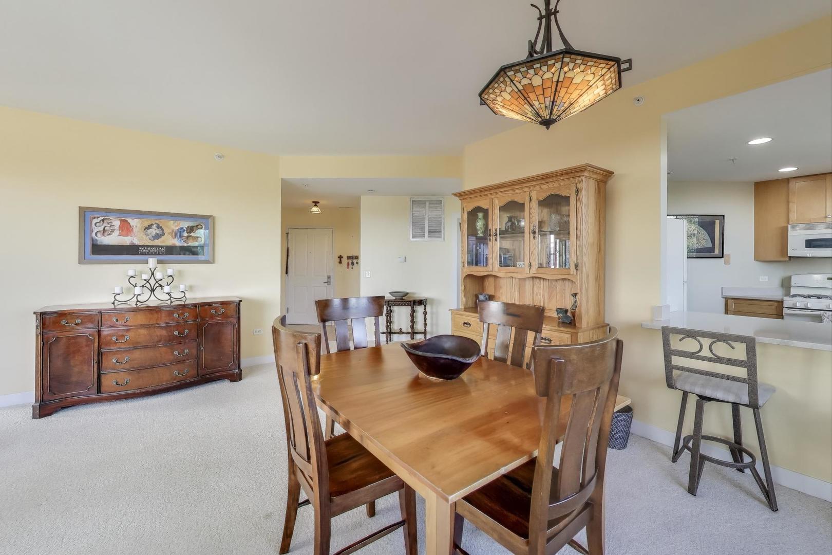 977 Harris Road, Unit 34 Grayslake, IL 60030 - Photo 8 of 27 a view of a dining room with furniture