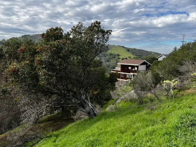 a aerial view of a house with a yard