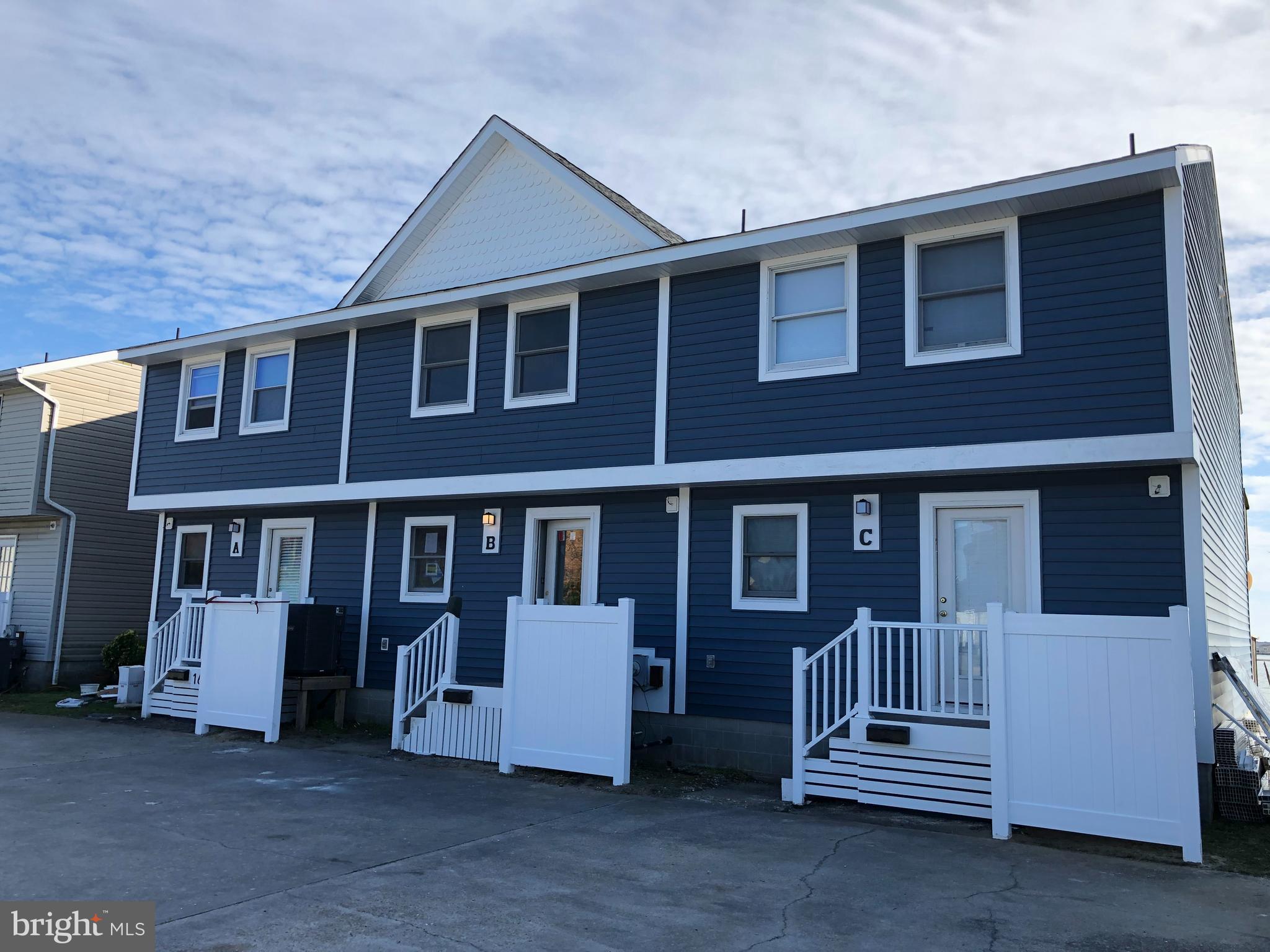 165 Jamestown Road Ocean City, MD 21842 - Photo 1 of 14 a front view of a house with a balcony