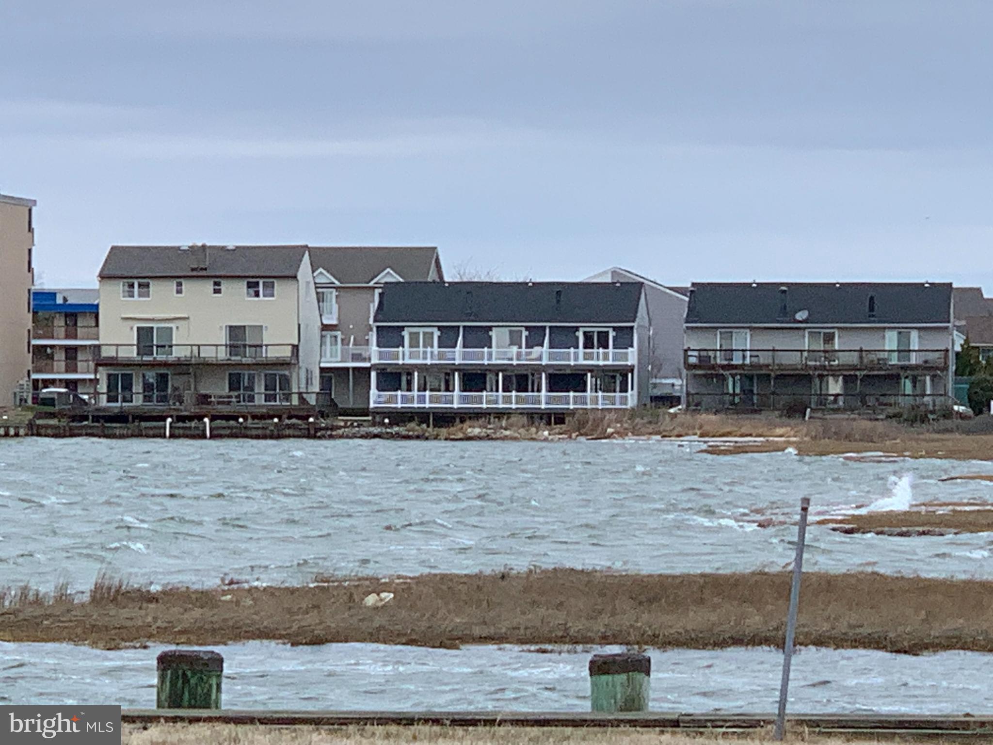 165 Jamestown Road Ocean City, MD 21842 - Photo 12 of 14 a view of a building with a yard