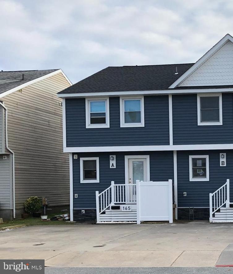 165 Jamestown Road Ocean City, MD 21842 - Photo 2 of 14 a front view of a house with a yard