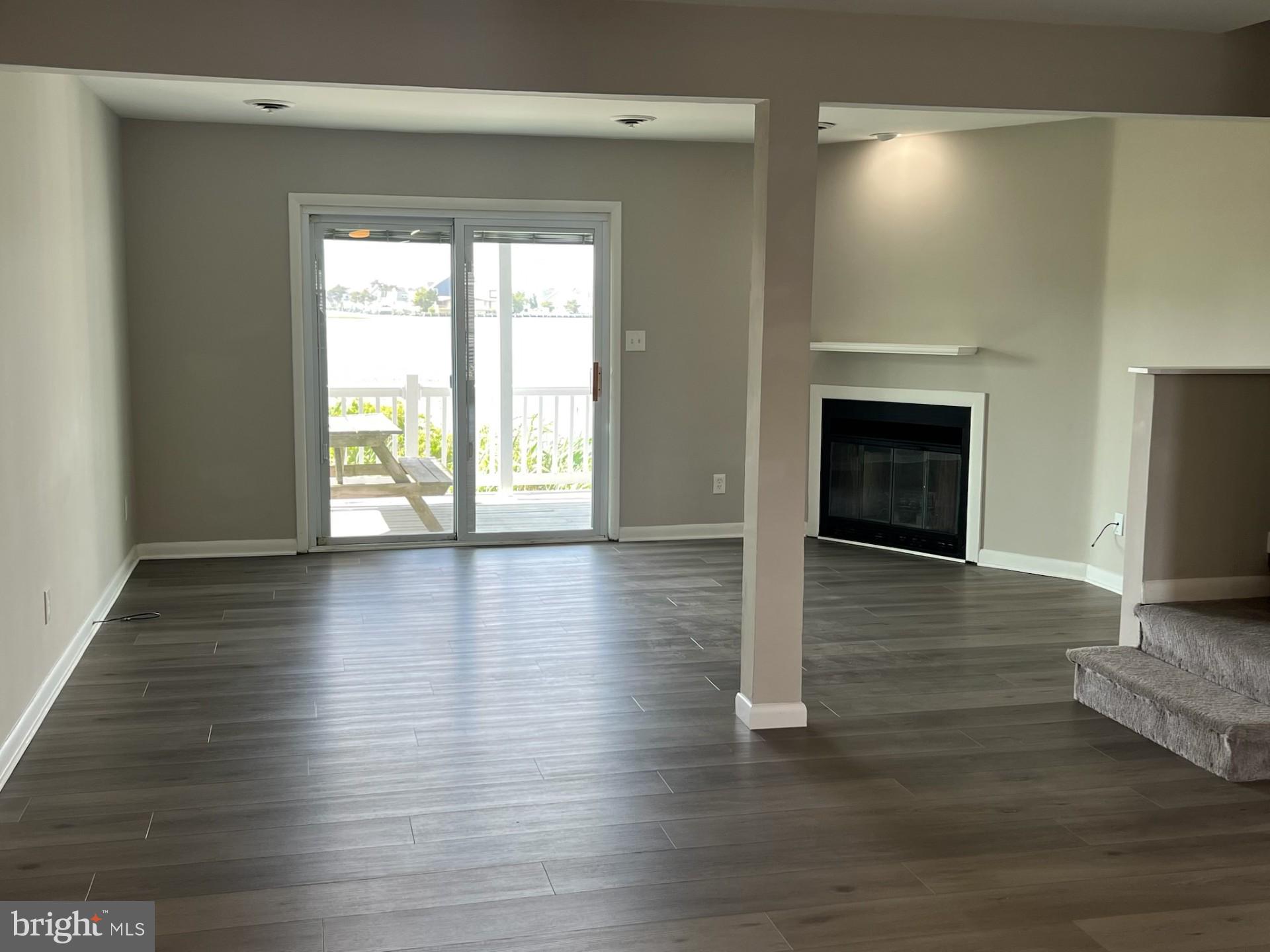 165 Jamestown Road Ocean City, MD 21842 - Photo 3 of 14 a view of a livingroom with wooden floor