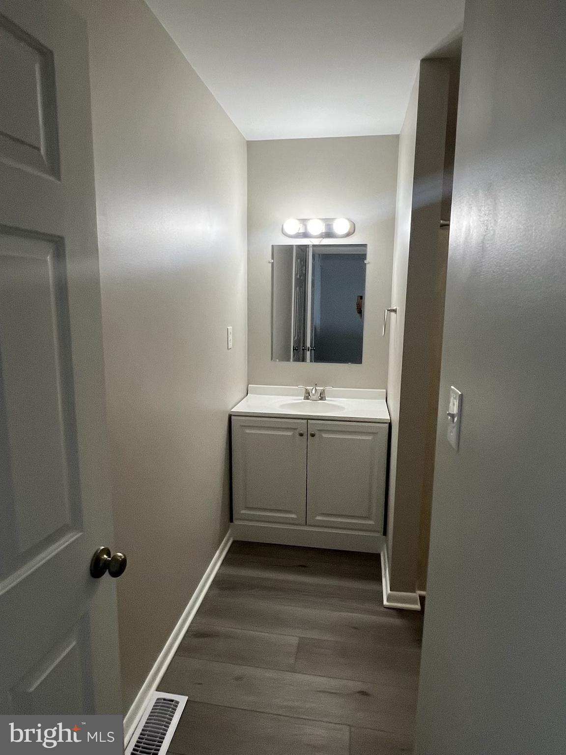 165 Jamestown Road Ocean City, MD 21842 - Photo 10 of 14 a bathroom with a sink and mirror
