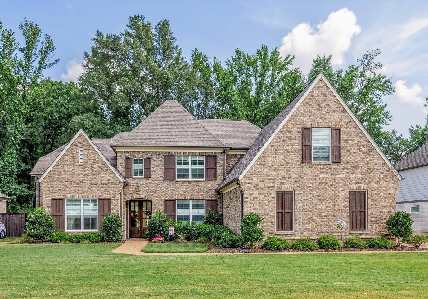 10500 Riley River Road Lakeland, TN 38002 - Photo 1 of 40 View of front facade featuring brick siding, a front lawn, and roof with shingles
