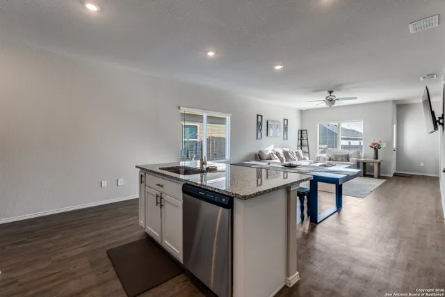 a kitchen with a sink and stove