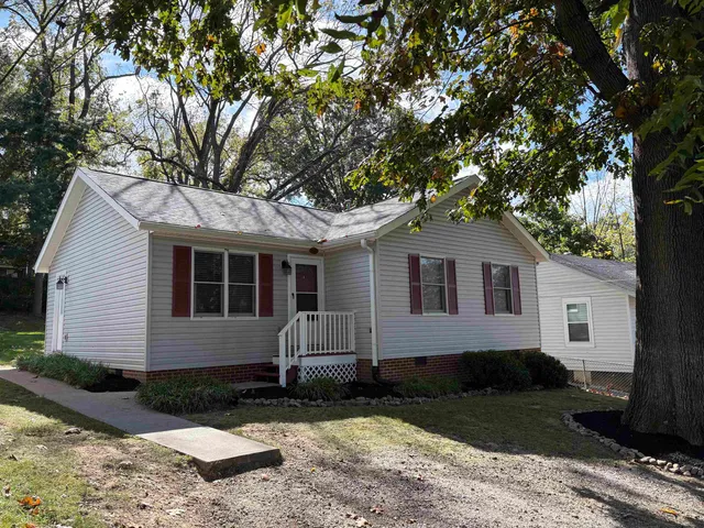 a front view of a house with yard