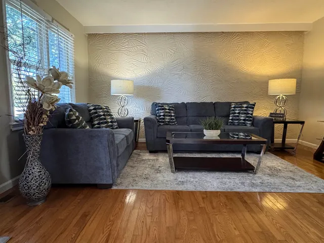 a living room with furniture and a couch