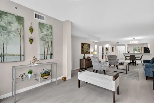 a en suite bathroom with a double vanity sink and a large mirror