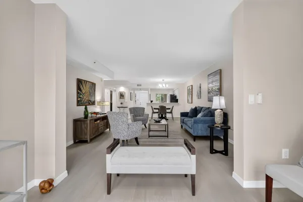 a bathroom with a toilet a sink a mirror a bathtub and shower