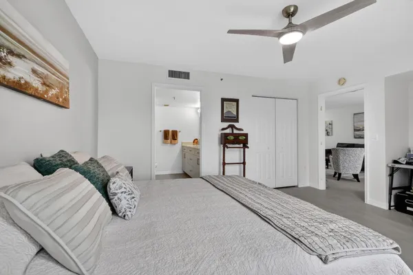 a bedroom with a bed and a view of bathroom