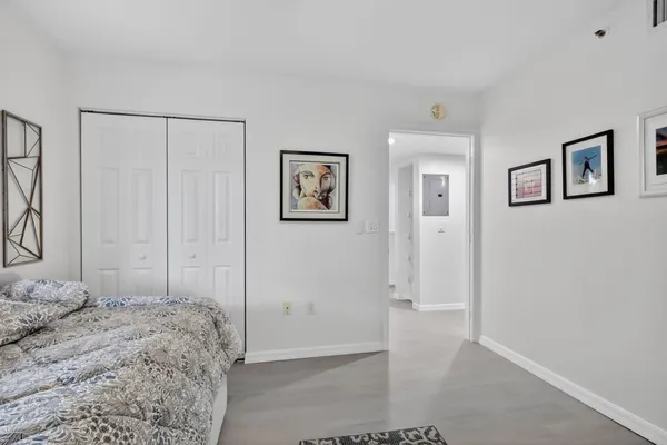 an aerial view of a house with a swimming pool yard and lake view
