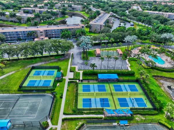 a room with chairs pool table and chairs