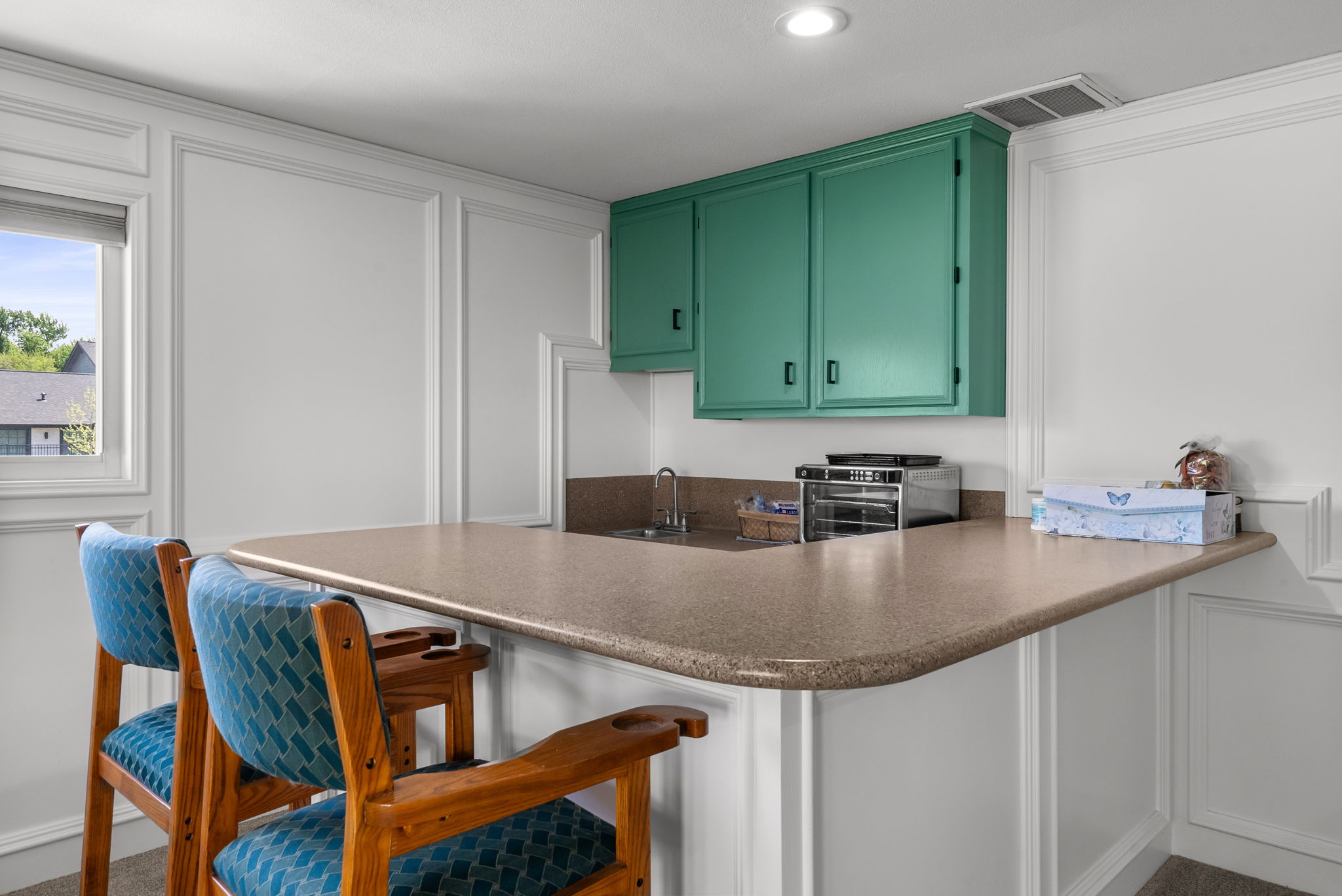 2702 Double Tree Street Round Rock, TX 78681 - Photo 16 of 40 a kitchen with a sink cabinets and wooden floor