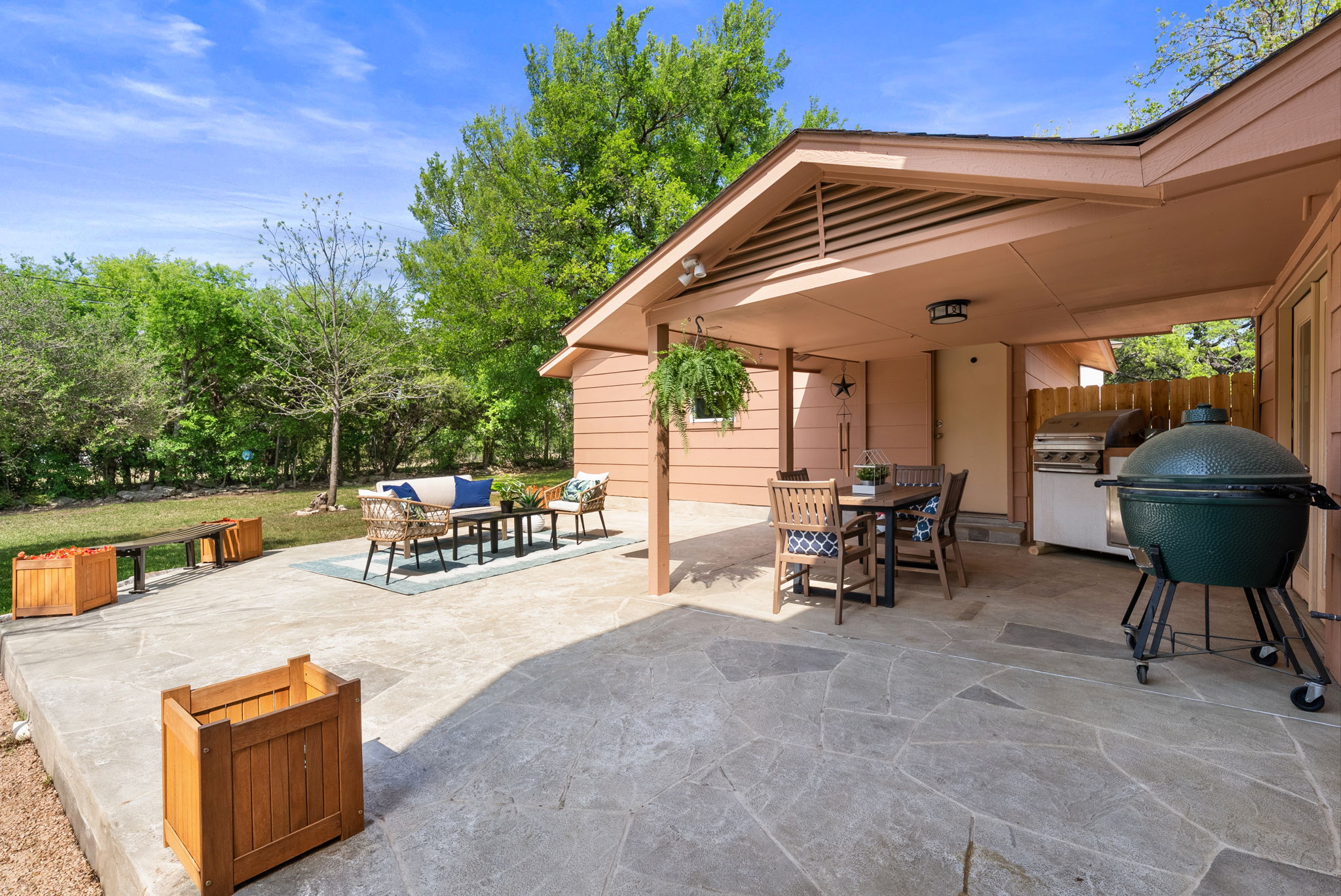 2702 Double Tree Street Round Rock, TX 78681 - Photo 2 of 40 a view of backyard with a table and chairs under an umbrella with a small yard