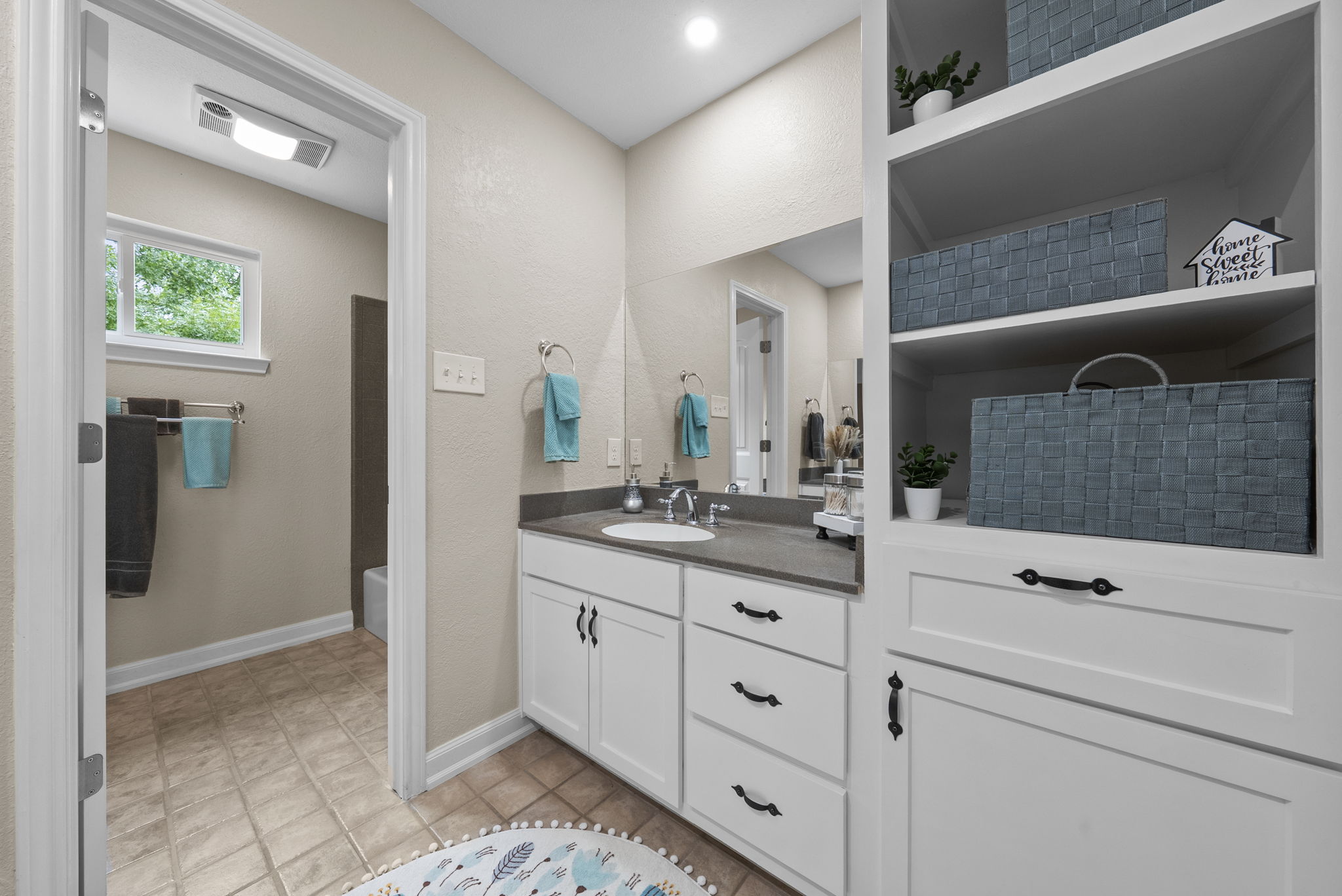 2702 Double Tree Street Round Rock, TX 78681 - Photo 24 of 40 a bathroom with a sink and a mirror