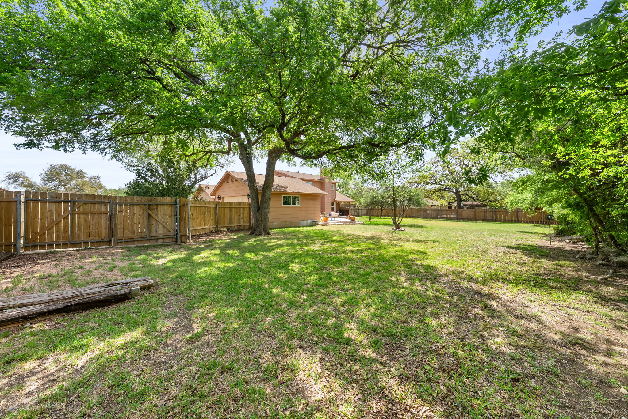 2702 Double Tree Street Round Rock, TX 78681 - Photo 32 of 40 a swimming pool with wooden fence