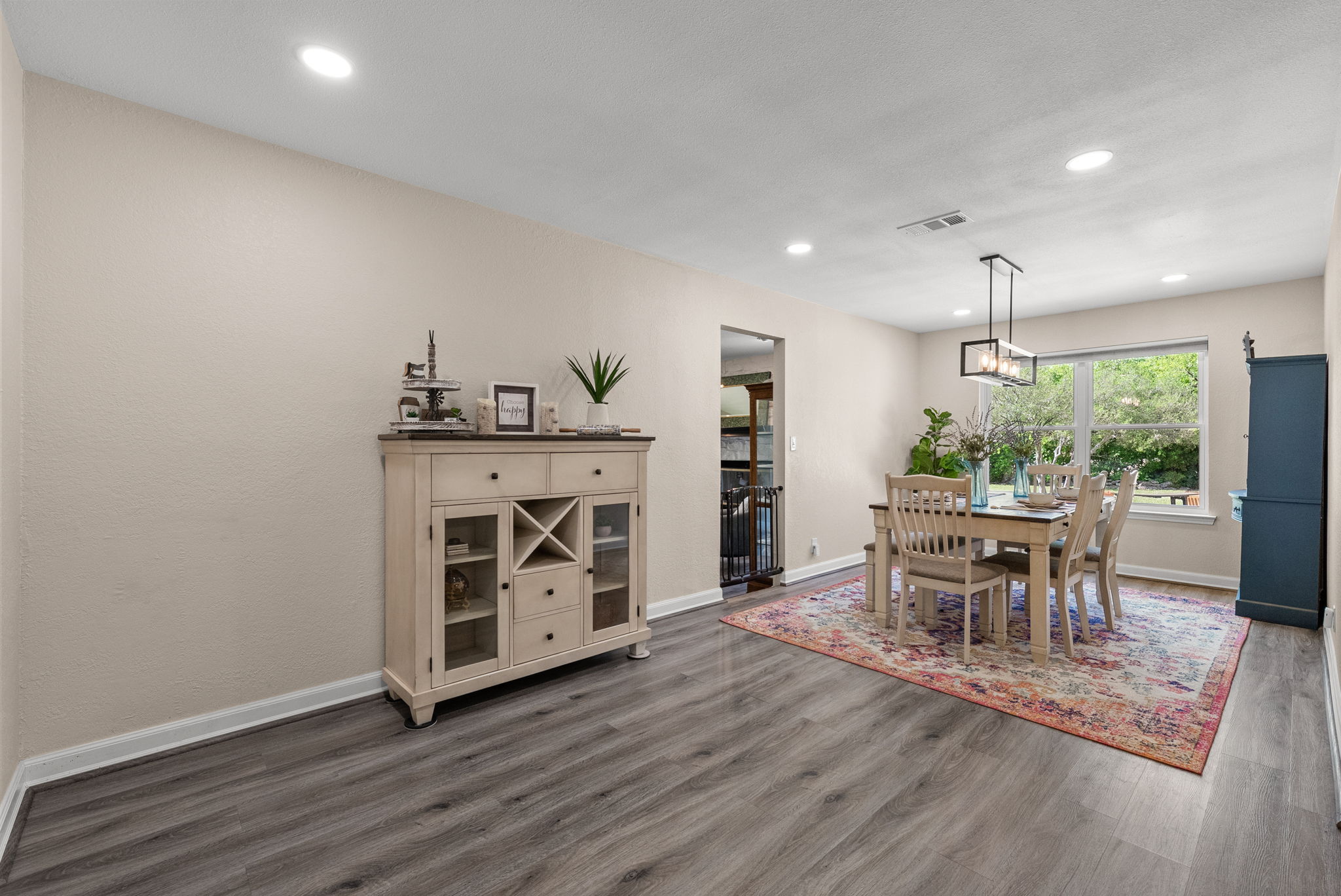 2702 Double Tree Street Round Rock, TX 78681 - Photo 4 of 40 a dining room with furniture and wooden floor