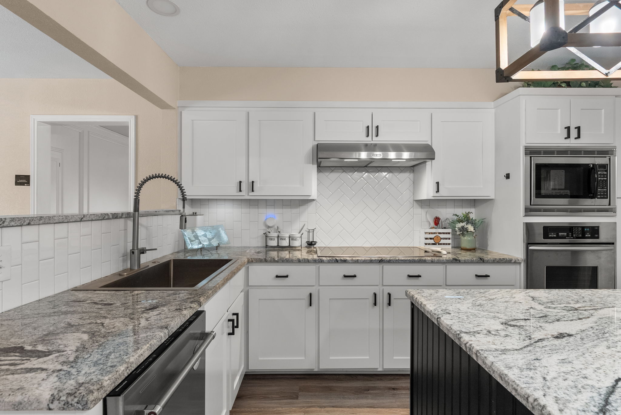 2702 Double Tree Street Round Rock, TX 78681 - Photo 7 of 40 a kitchen with stainless steel appliances granite countertop a sink stove and cabinets