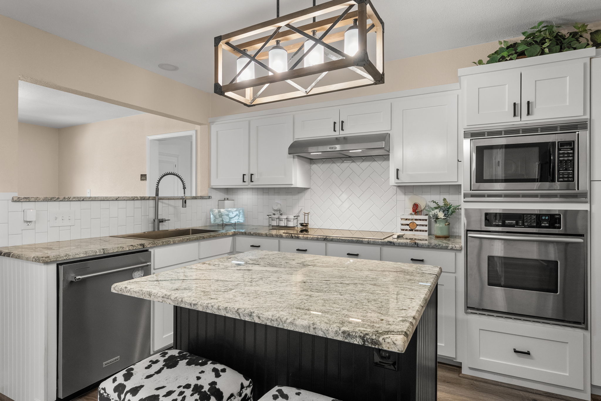 2702 Double Tree Street Round Rock, TX 78681 - Photo 8 of 40 a kitchen with stainless steel appliances granite countertop a sink stove and cabinets
