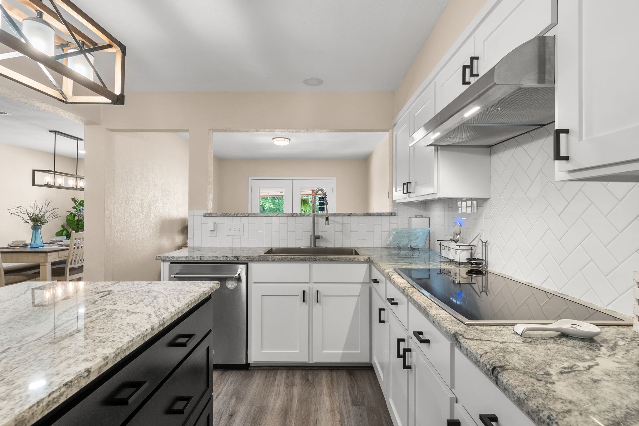 2702 Double Tree Street Round Rock, TX 78681 - Photo 9 of 40 a kitchen with a sink stove and cabinets