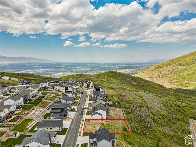 14673 South Ravine Rock Way East, Unit 720 Draper, UT 84020 - Photo 6 of 15 Aerial perspective of suburban area with property parcel outlined and a mountain backdrop