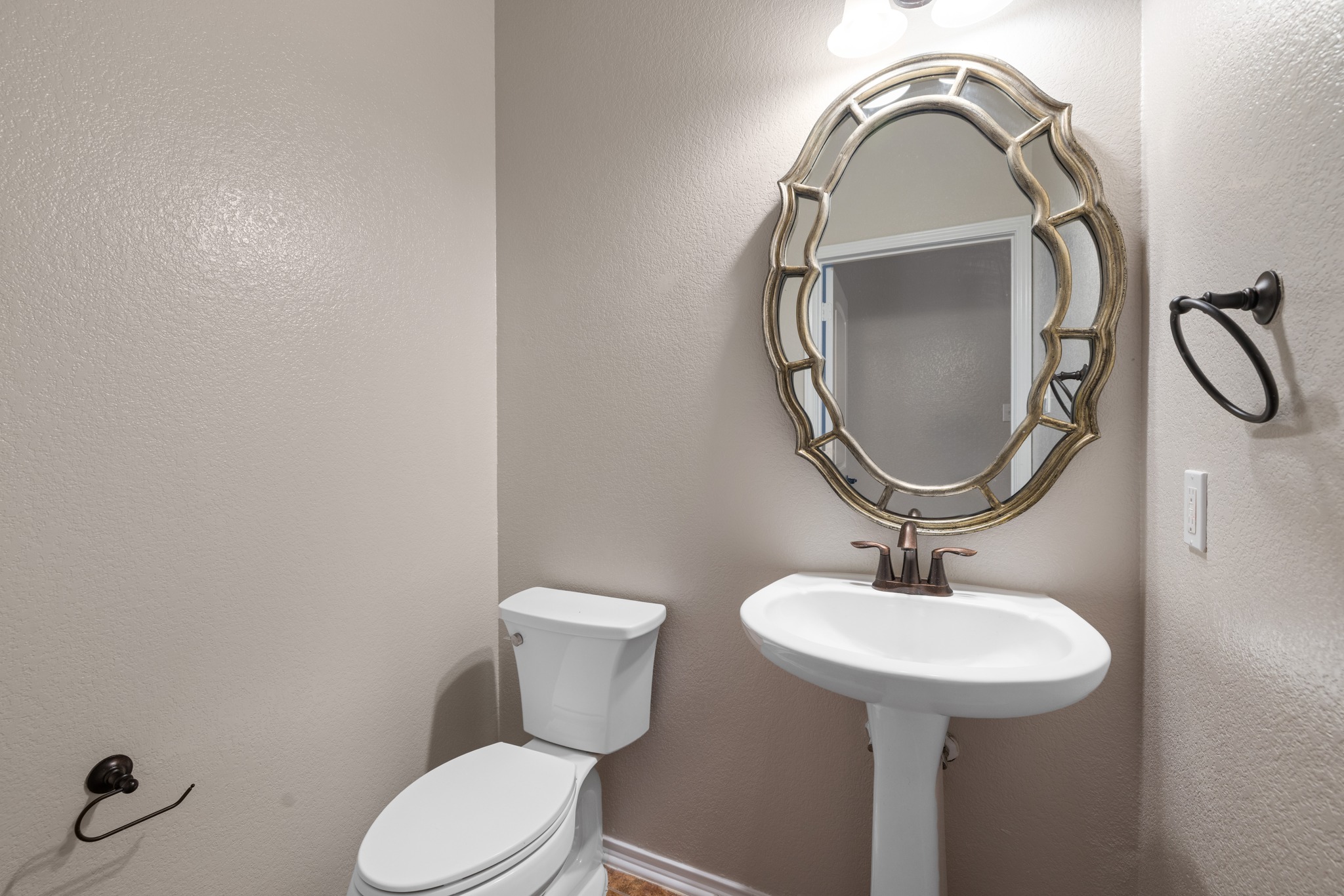 403 Red Hawk Drive Leander, TX 78641 - Photo 15 of 37 Pedestal sink with bronze faucet and ornate framed mirror