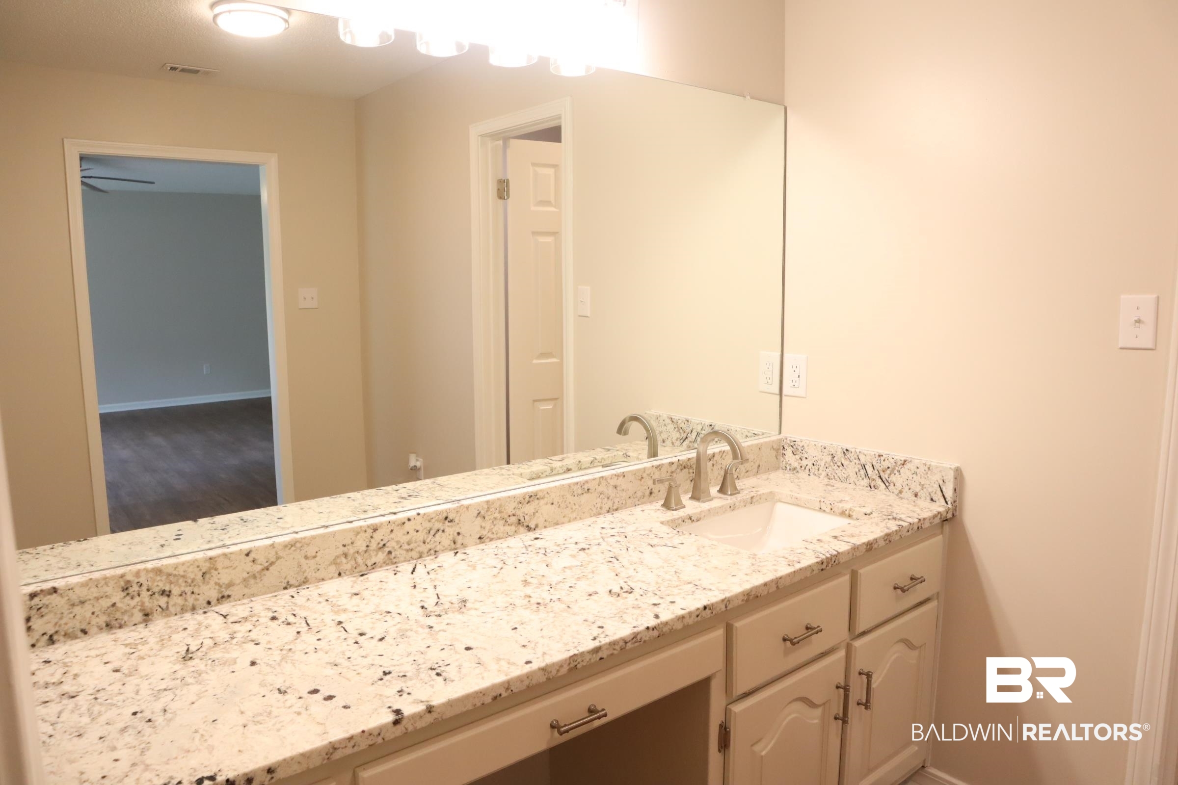 12150 Lee Bishop Road Irvington, AL 36544 - Photo 16 of 26 Bathroom featuring baseboards, visible vents, and vanity