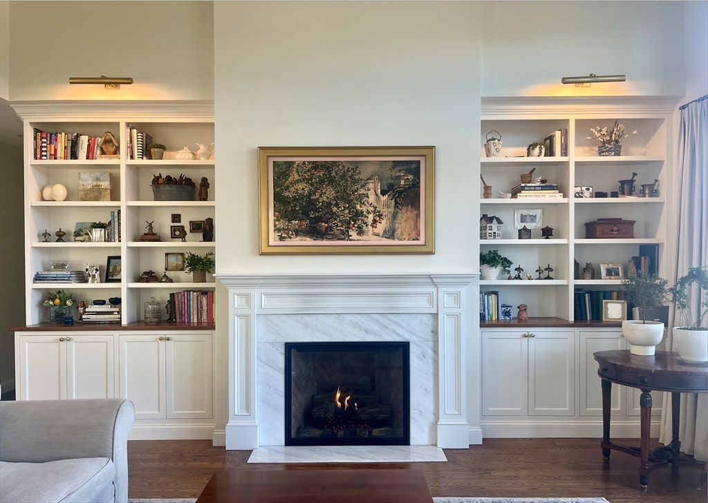 22 Sunset Way, Unit 22 Medfield, MA 02052 - Photo 12 of 42 a living room with furniture and a fireplace
