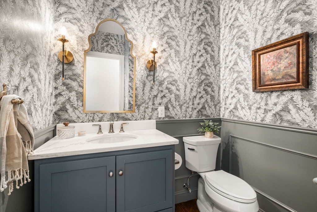 22 Sunset Way, Unit 22 Medfield, MA 02052 - Photo 20 of 42 a bathroom with a toilet sink and mirror