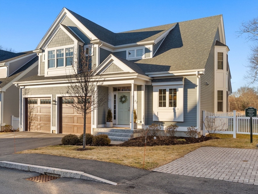 22 Sunset Way, Unit 22 Medfield, MA 02052 - Photo 2 of 42 a front view of a house with a yard